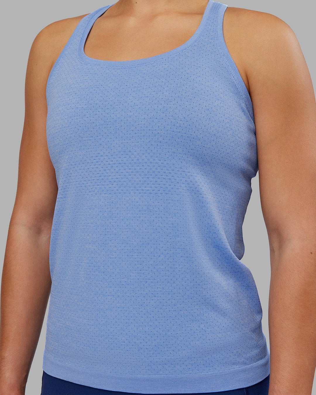 Woman wearing AeroFLX+ Seamless Tank - Cornflower Blue Marl | Model:Keisha | Size:S