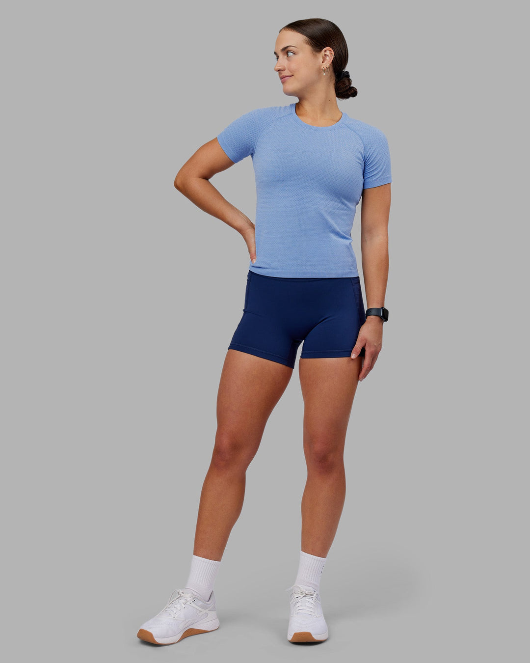 Woman wearing AeroFLX+ Seamless Tee - Cornflower Blue/Cornflower Blue | Model:Keisha | Size:S