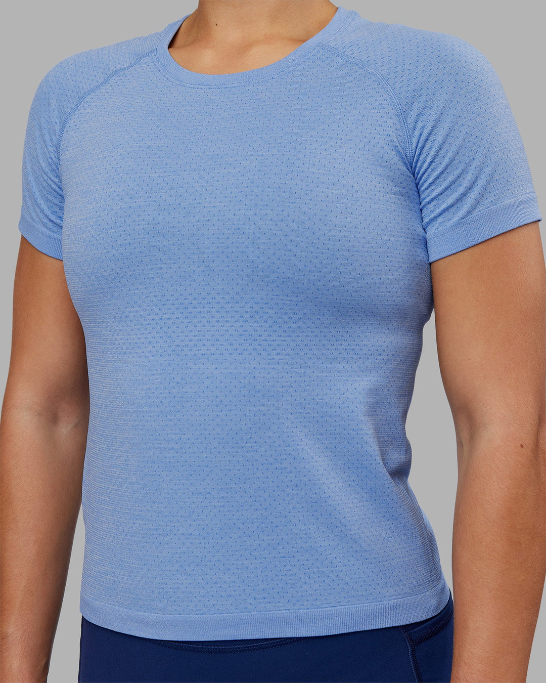 Woman wearing AeroFLX+ Seamless Tee - Cornflower Blue/Cornflower Blue | Model:Keisha | Size:S