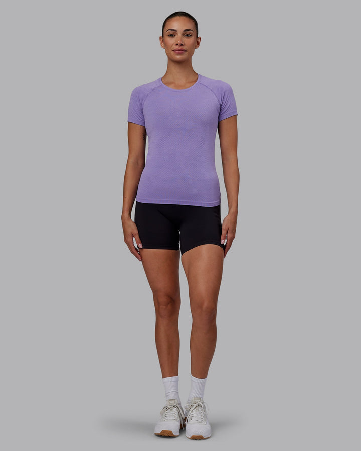 Woman wearing AeroFLX+ Seamless Tee - Dahlia Purple Marl
