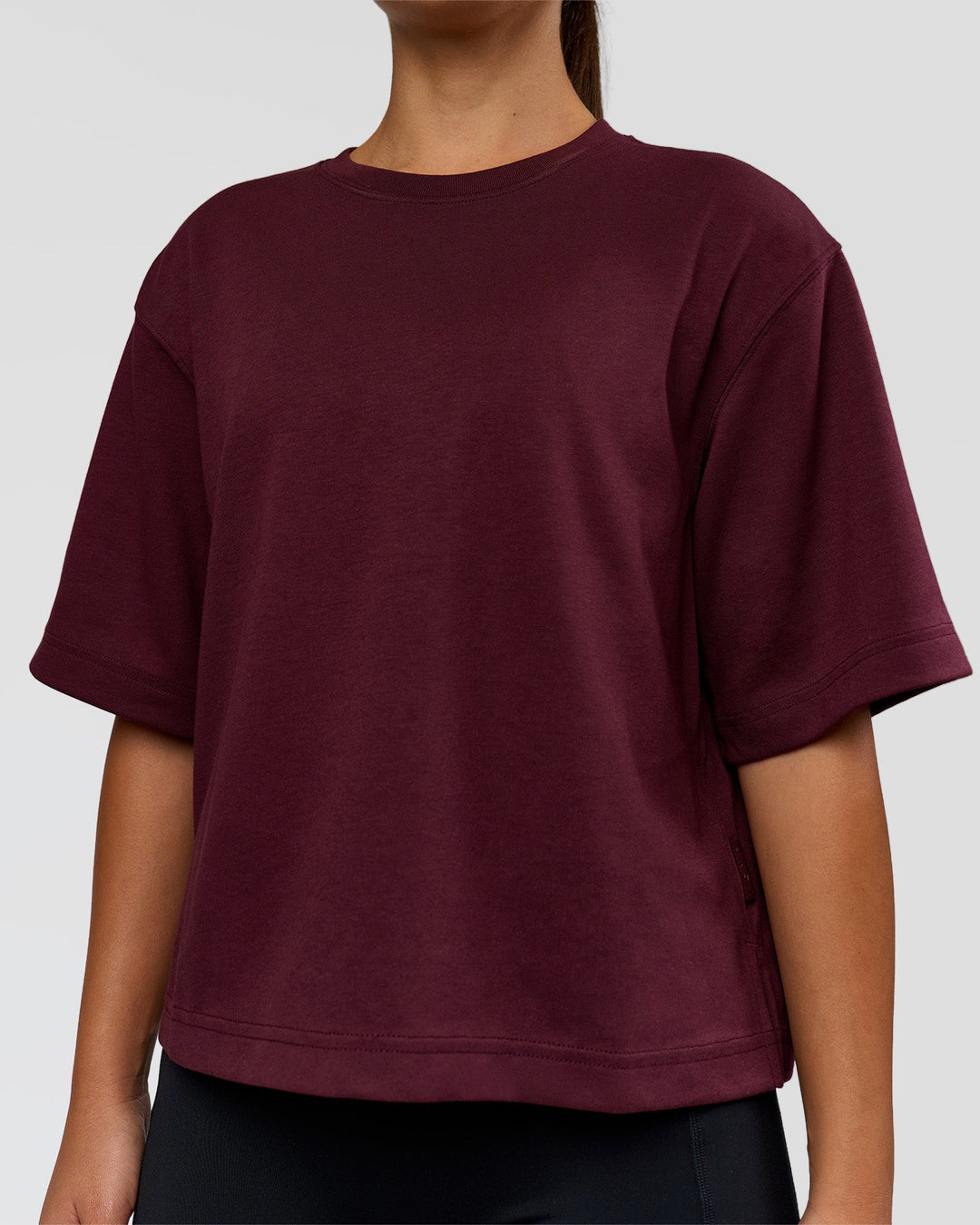 Woman wearing AfterDark ZeroCrease Cropped Tee - Cherry Lacquer | Model:Sophia | Size:S