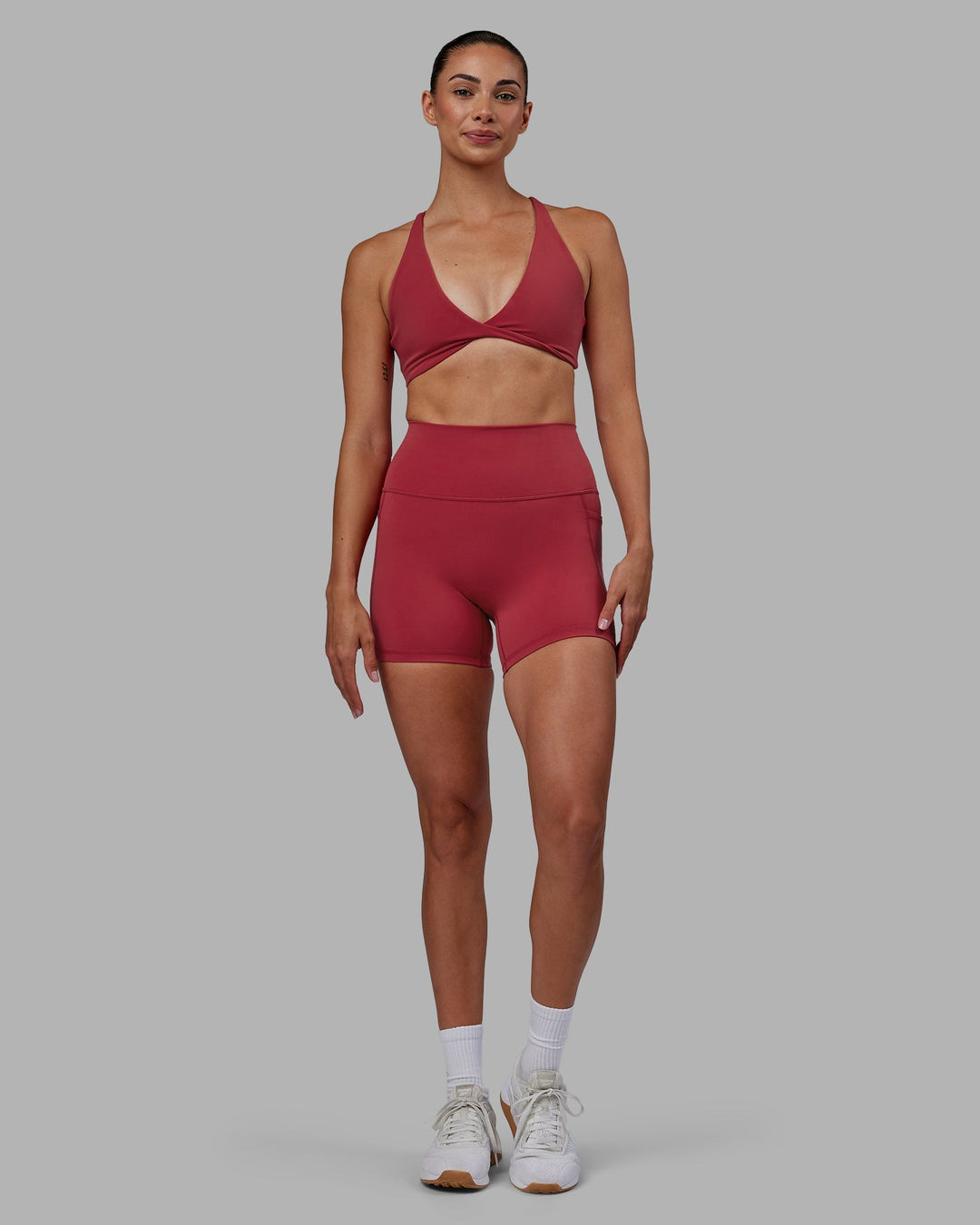 Woman wearing Agile Sports Bra - Claret