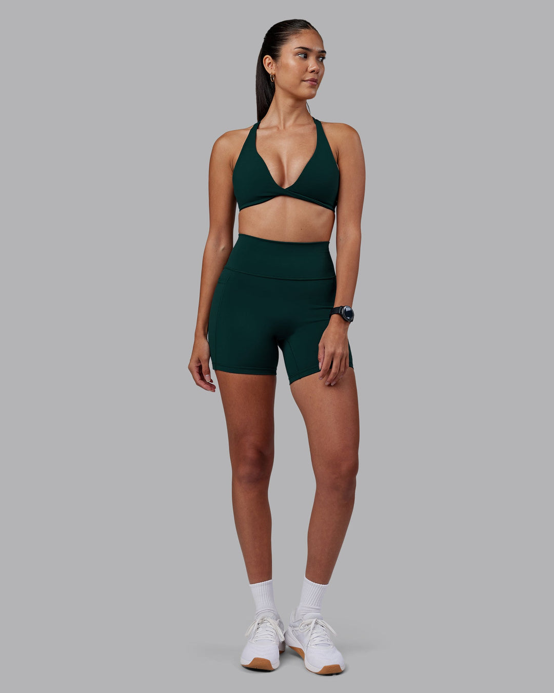 Woman wearing Agile Sports Bra - Dark Moss | Model:Rhiley | Size:S