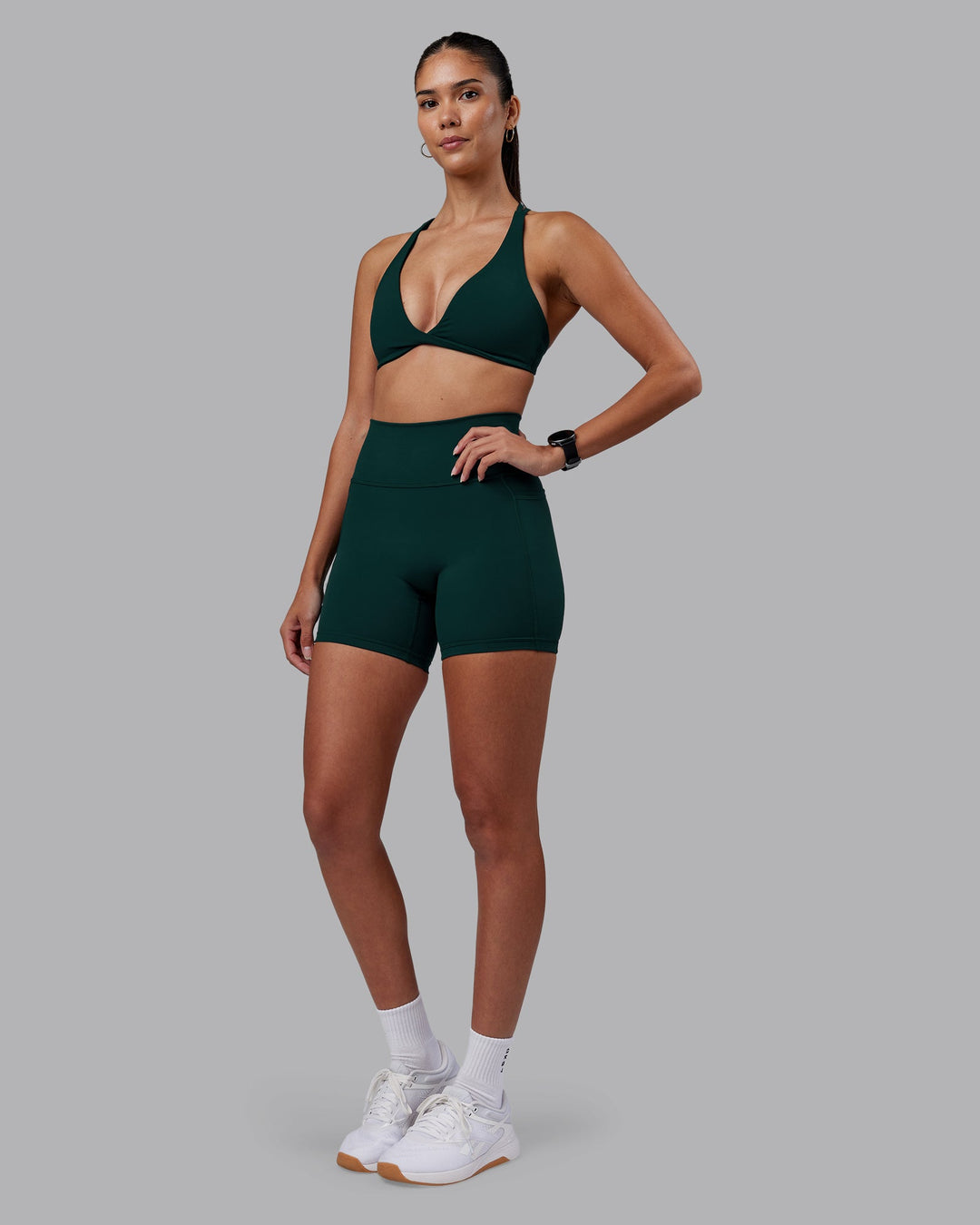 Woman wearing Agile Sports Bra - Dark Moss | Model:Rhiley | Size:S