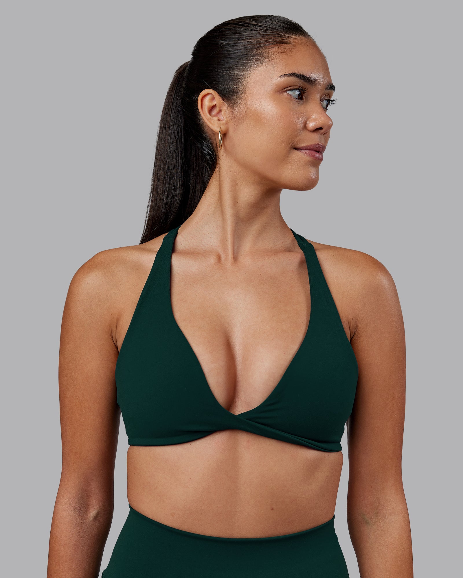 Woman wearing Agile Sports Bra - Dark Moss | Model:Rhiley | Size:S