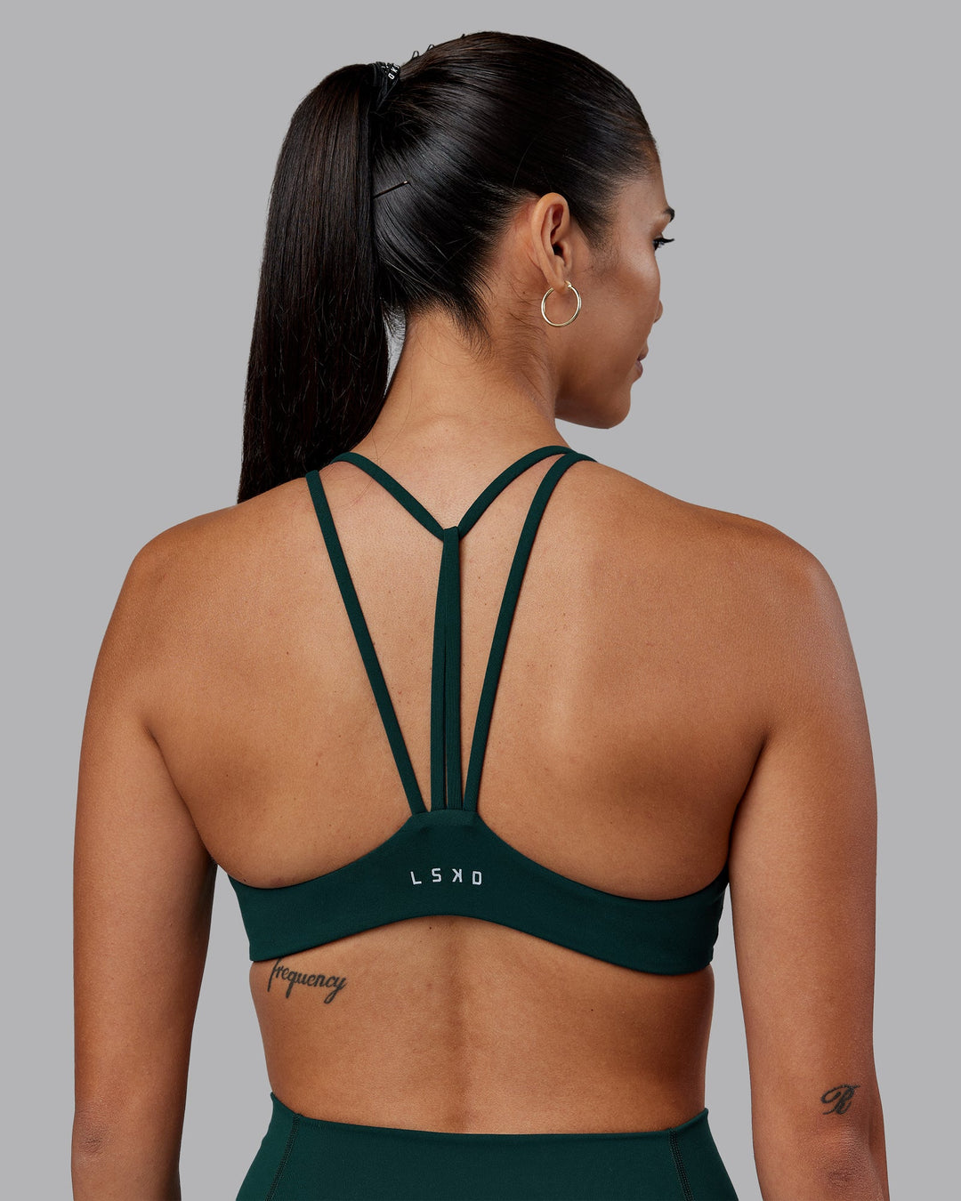 Woman wearing Agile Sports Bra - Dark Moss | Model:Rhiley | Size:S