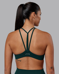 Woman wearing Agile Sports Bra - Dark Moss | Model:Rhiley | Size:S | Thumbnail Index: 1