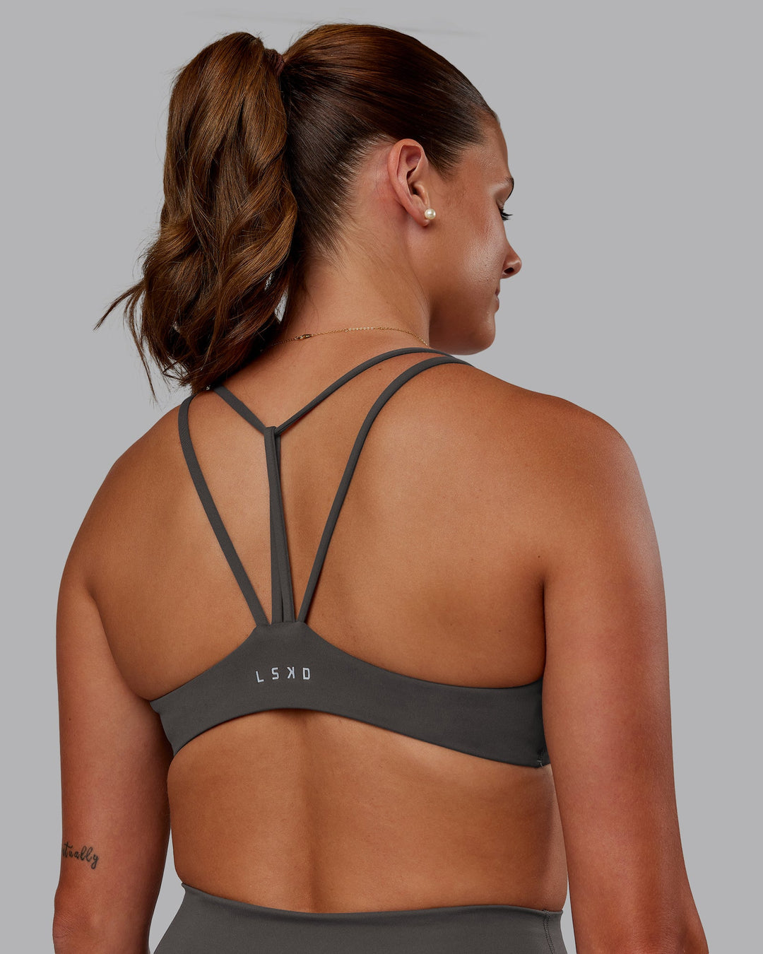 Woman wearing Agile Sports Bra - Dark Storm | Model:Phoebe | Size:S