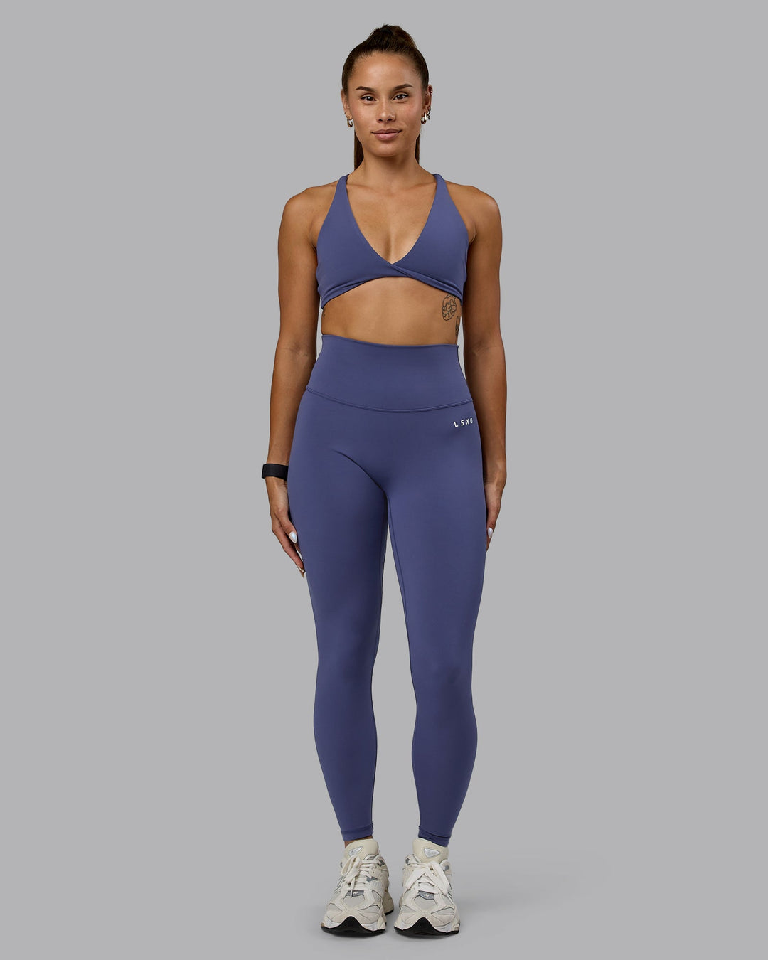 Woman wearing Agile Sports Bra - Future Dusk