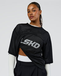 Woman wearing AirCore Jersey - Black-Black | Model:Rosie | Size:S