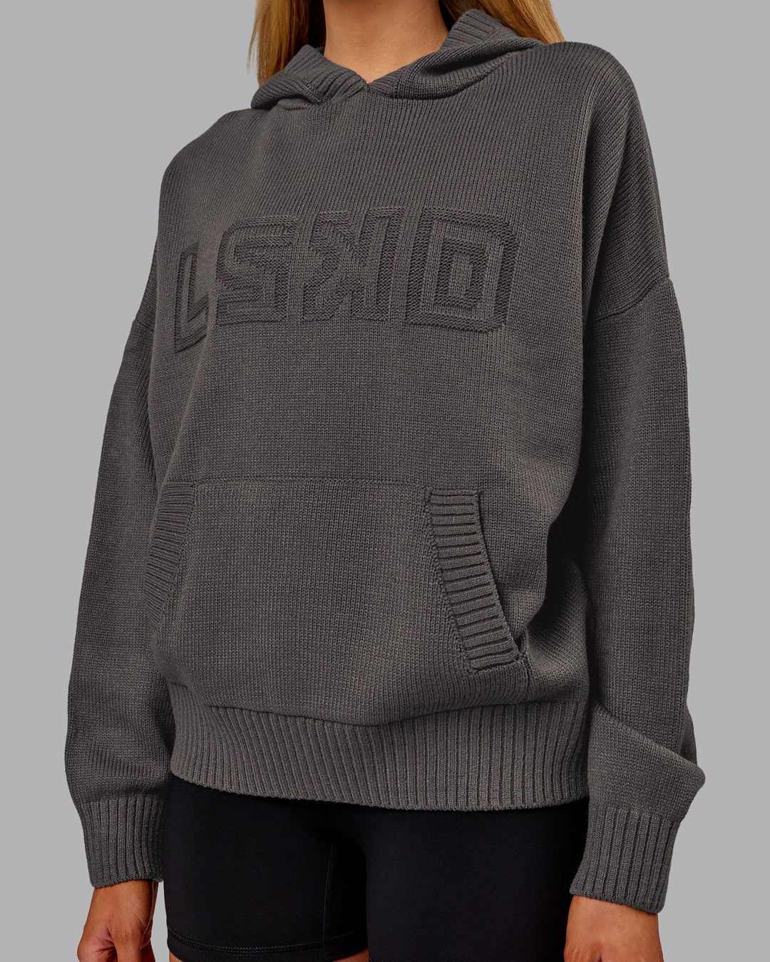Woman wearing All Day Active Knitted Hoodie - Dark Storm | Model:Ella | Size:S