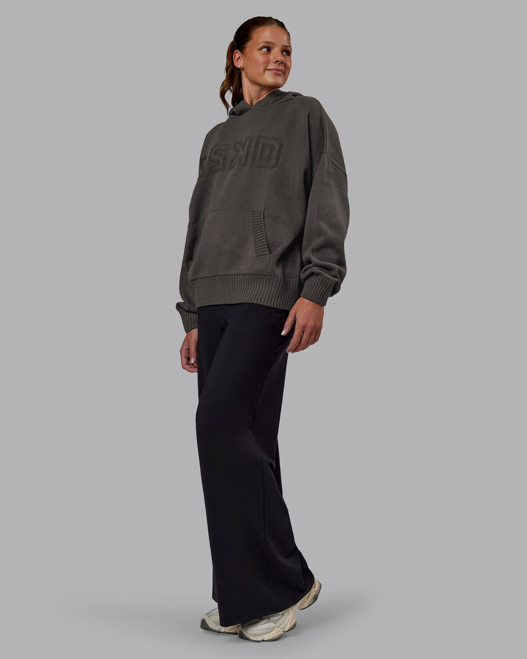 Woman wearing All Day Active Knitted Hoodie - Dark Storm | Model:Phoebe | Size:S