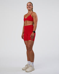 Woman wearing Ambience Sports Bra - Flame | Model:Sav | Size:S