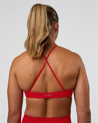Woman wearing Ambience Sports Bra - Flame | Model:Sav | Size:S