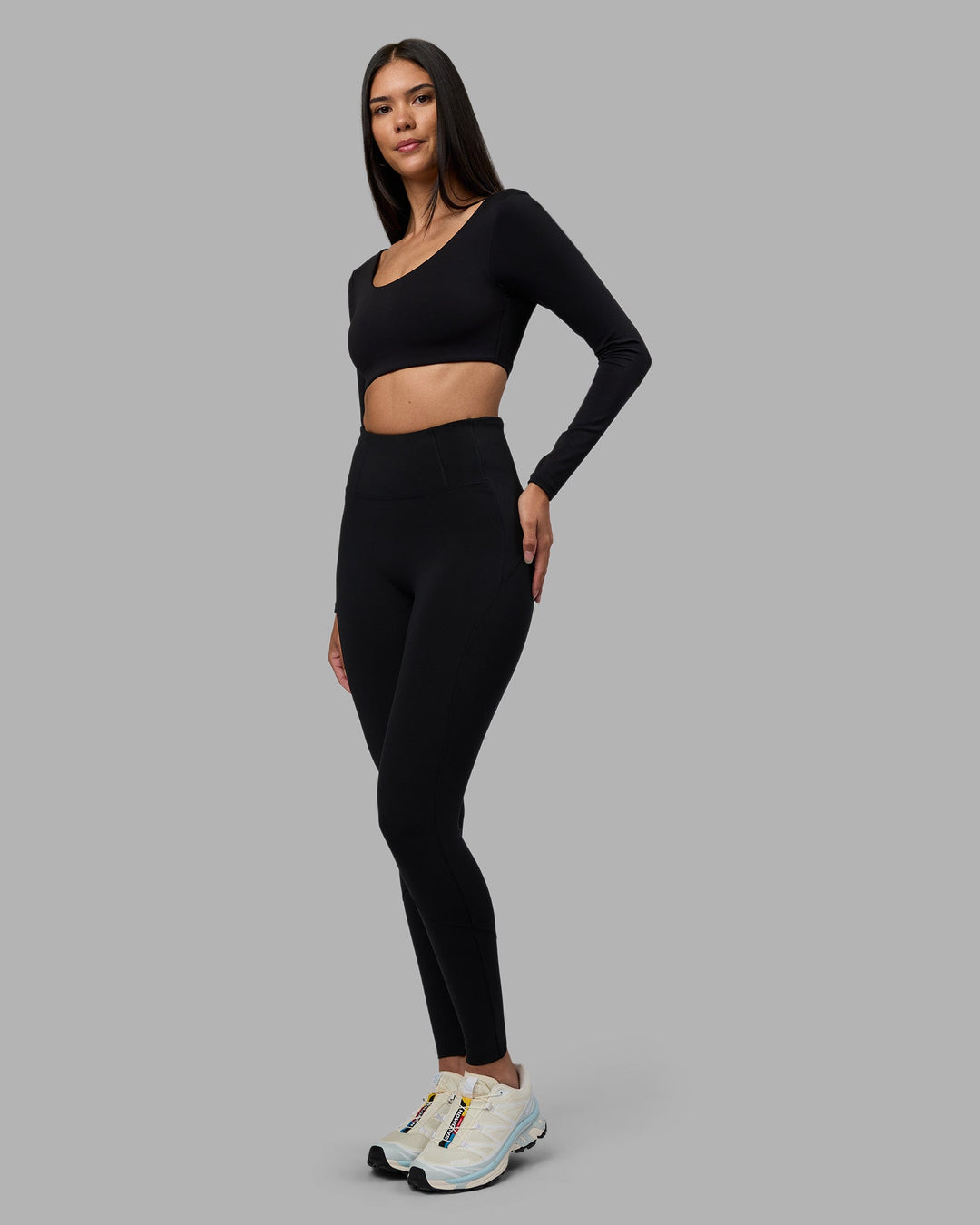 Woman wearing Aria Long Sleeve Sports Bra - Black | Model:Rhiley | Size:S