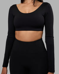Woman wearing Aria Long Sleeve Sports Bra - Black | Model:Rhiley | Size:S | Thumbnail Index: 3