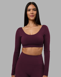 Woman wearing Aria Long Sleeve Sports Bra - Cherry Lacquer | Model:Rhiley | Size:S | Thumbnail Index: 0