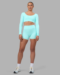 Woman wearing Aria Long Sleeve Sports Bra - Island Paradise | Model:Sophie | Size:S | Thumbnail Index: 7