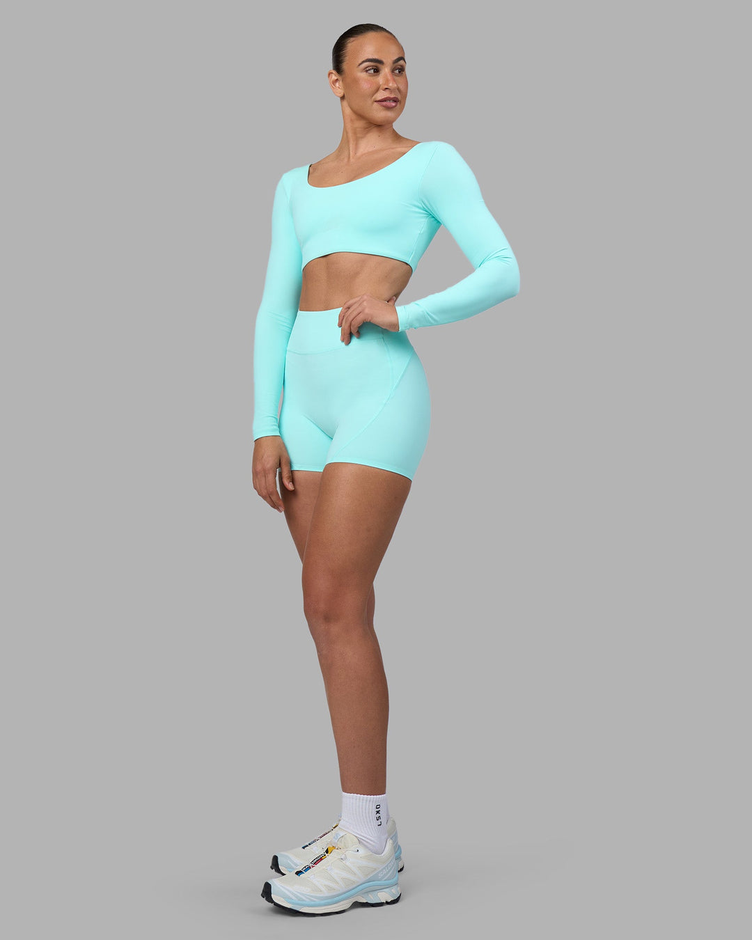 Woman wearing Aria Long Sleeve Sports Bra - Island Paradise | Model:Sophie | Size:S
