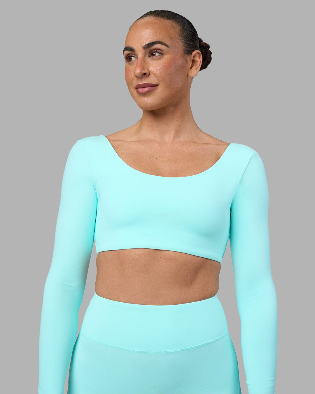 Woman wearing Aria Long Sleeve Sports Bra - Island Paradise | Model:Sophie | Size:S