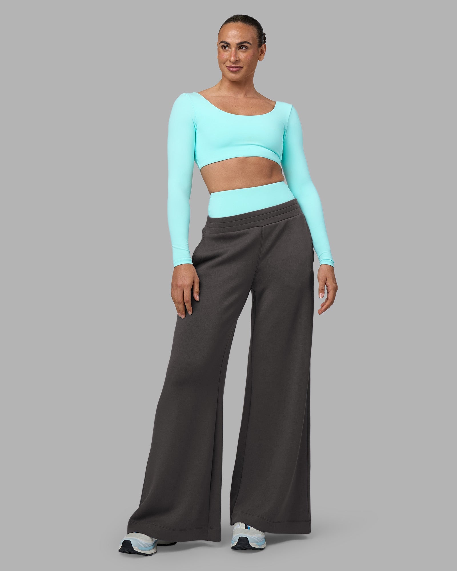 Woman wearing Aria Long Sleeve Sports Bra - Island Paradise | Model:Sophie | Size:S