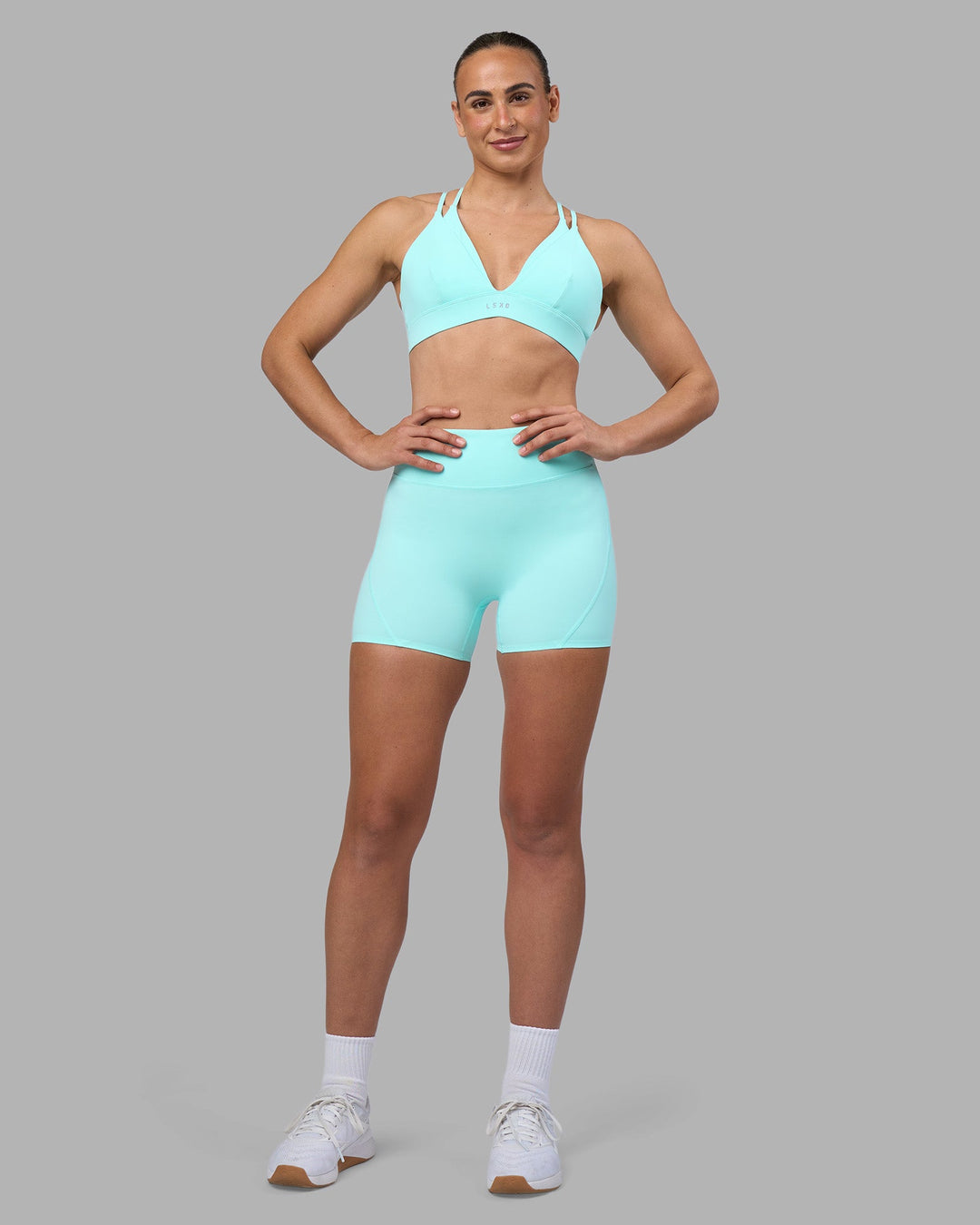 Woman wearing Aria Triangle Sports Bra - Island Paradise | Model:Sophie | Size:S - view 3