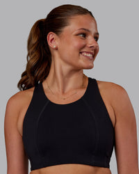 Woman wearing Ascent Sports Bra - Black | Model:Phoebe | Size:S | Thumbnail Index: 0