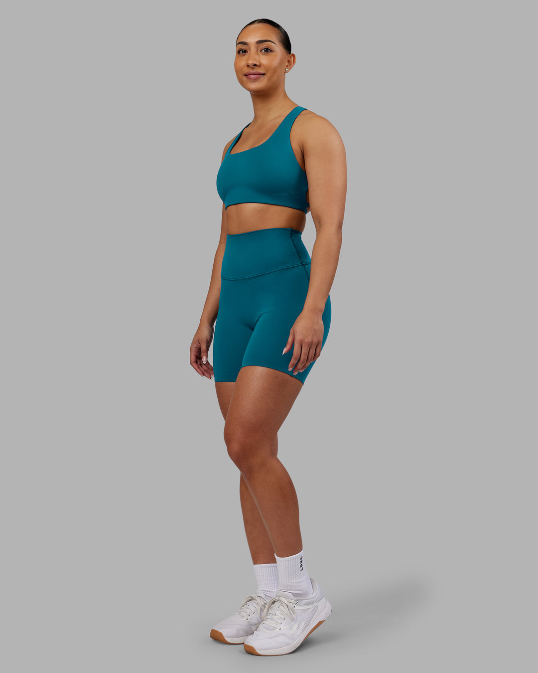 Woman wearing Aspire Sports Bra - Blue Coral | Model:Ayla| Size:S