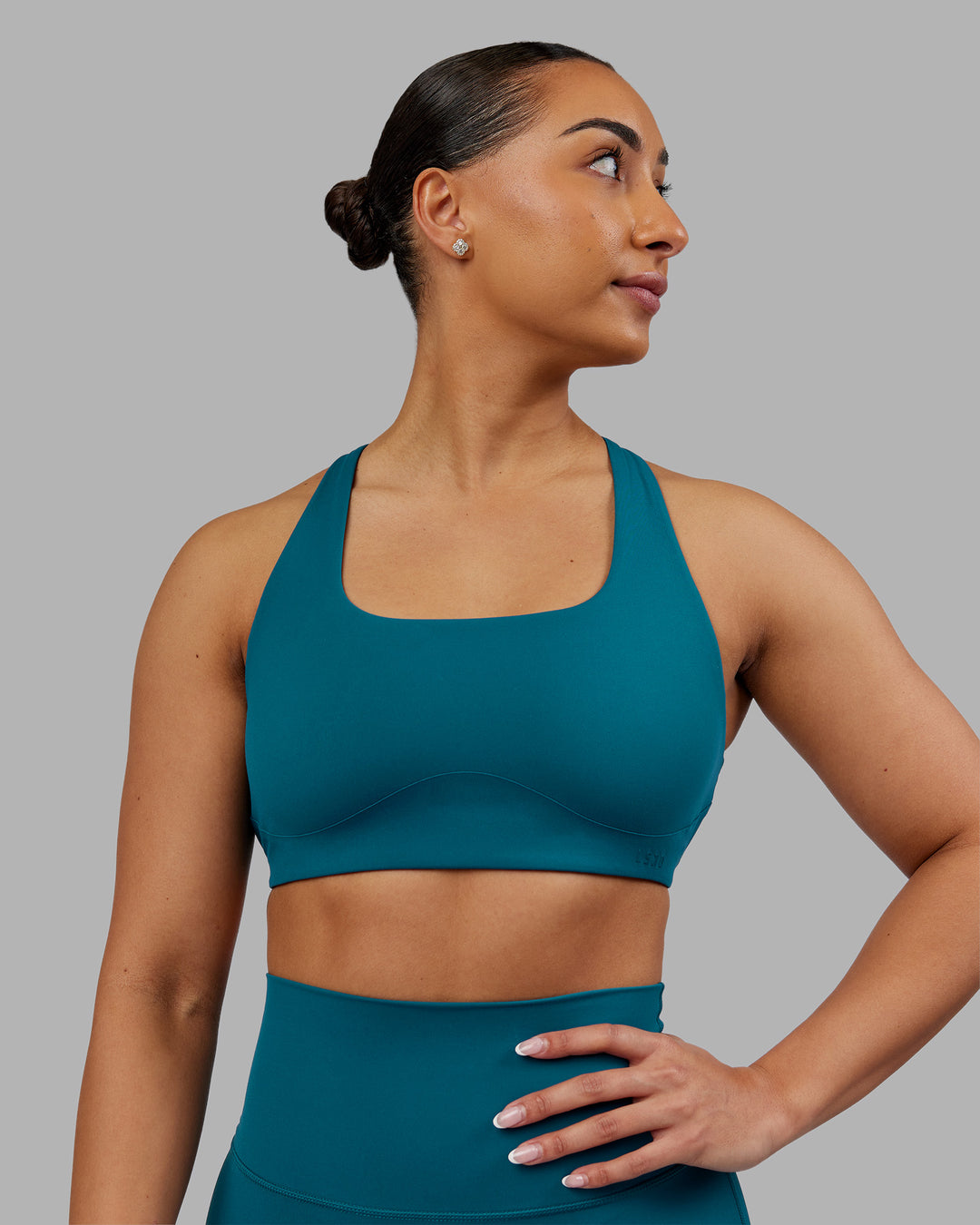 Woman wearing Aspire Sports Bra - Blue Coral | Model:Ayla| Size:S