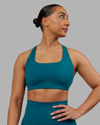 Woman wearing Aspire Sports Bra - Blue Coral | Model:Ayla| Size:S