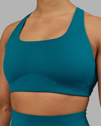 Woman wearing Aspire Sports Bra - Blue Coral | Model:Ayla| Size:S