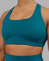 Woman wearing Aspire Sports Bra - Blue Coral | Model:Ayla | Size:S | Thumbnail Index: 3