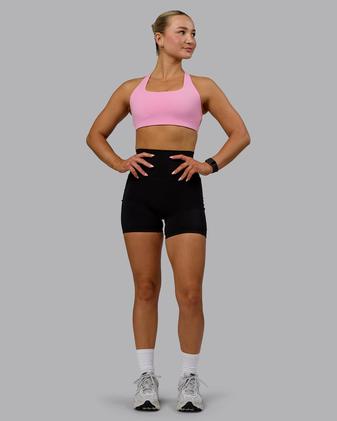 Woman wearing Aspire Sports Bra - Bubblegum