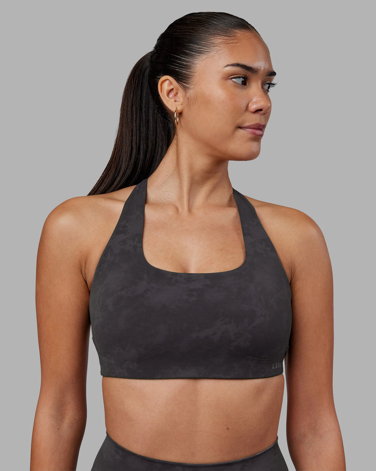 Woman wearing Aspire Sports Bra - Dark Storm Wash | Model:Rhiley | Size:S - view 2