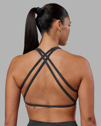 Woman wearing Aspire Sports Bra - Dark Storm Wash | Model:Rhiley | Size:S