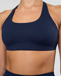 Woman wearing Aspire Sports Bra - Future Navy | Model:Evie | Size:S | Thumbnail Index: 3