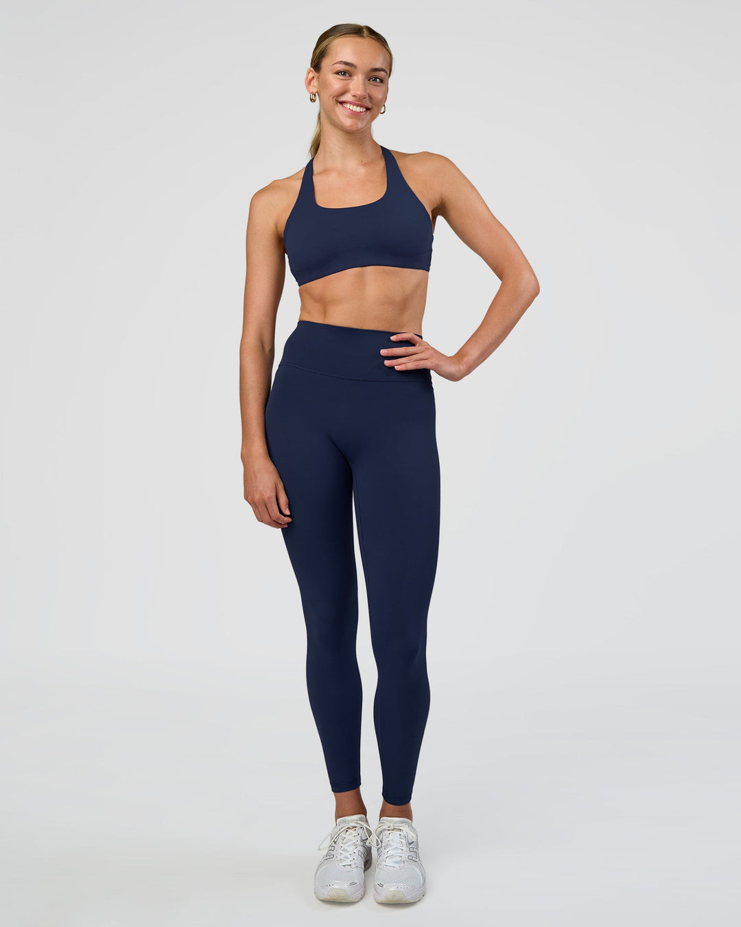 Woman wearing Aspire Sports Bra - Future Navy | Model:Evie | Size:S - view 6