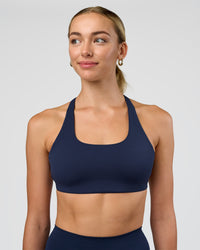 Woman wearing Aspire Sports Bra - Future Navy | Model:Evie | Size:S | Thumbnail Index: 1