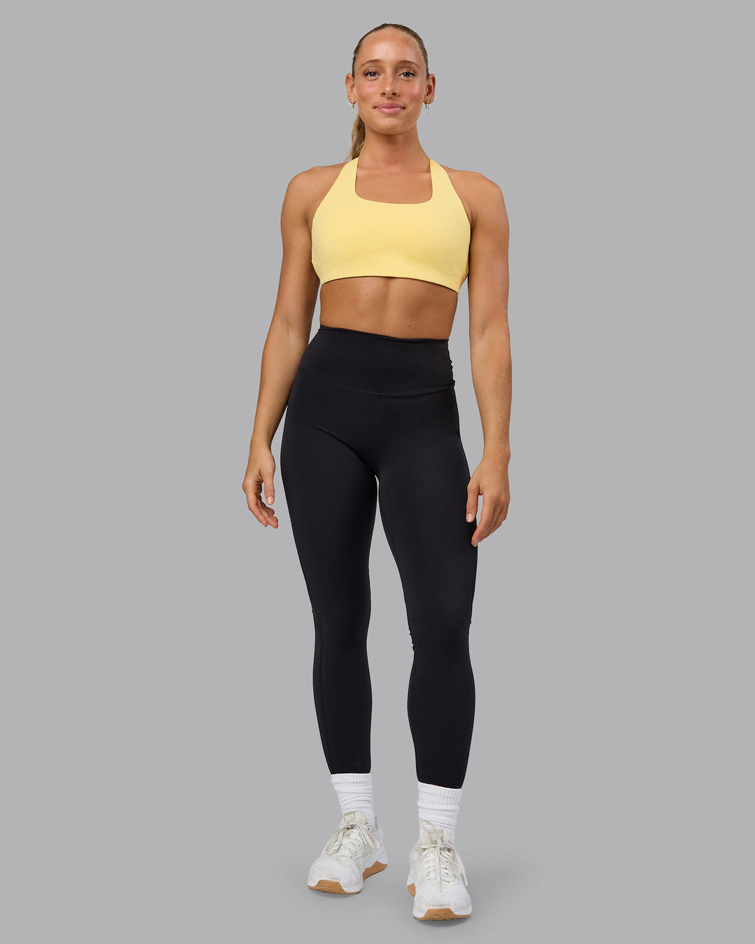 Woman wearing Aspire Sports Bra - Lemon