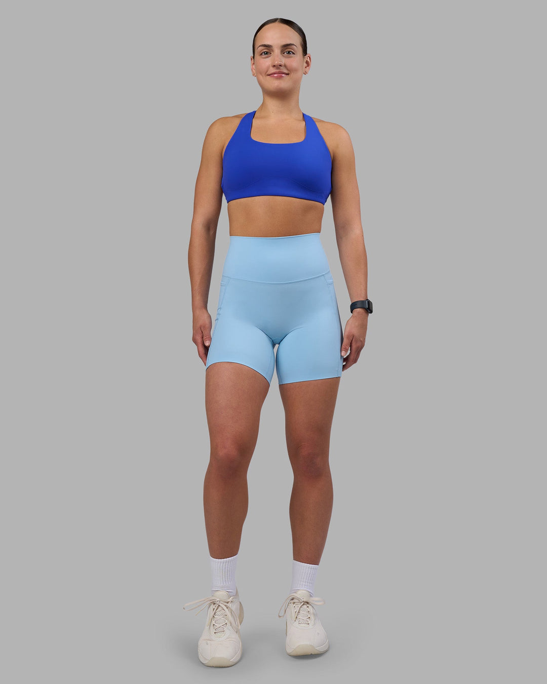 Woman wearing Aspire Sports Bra - Power Cobalt | Model:Keisha | Size:S