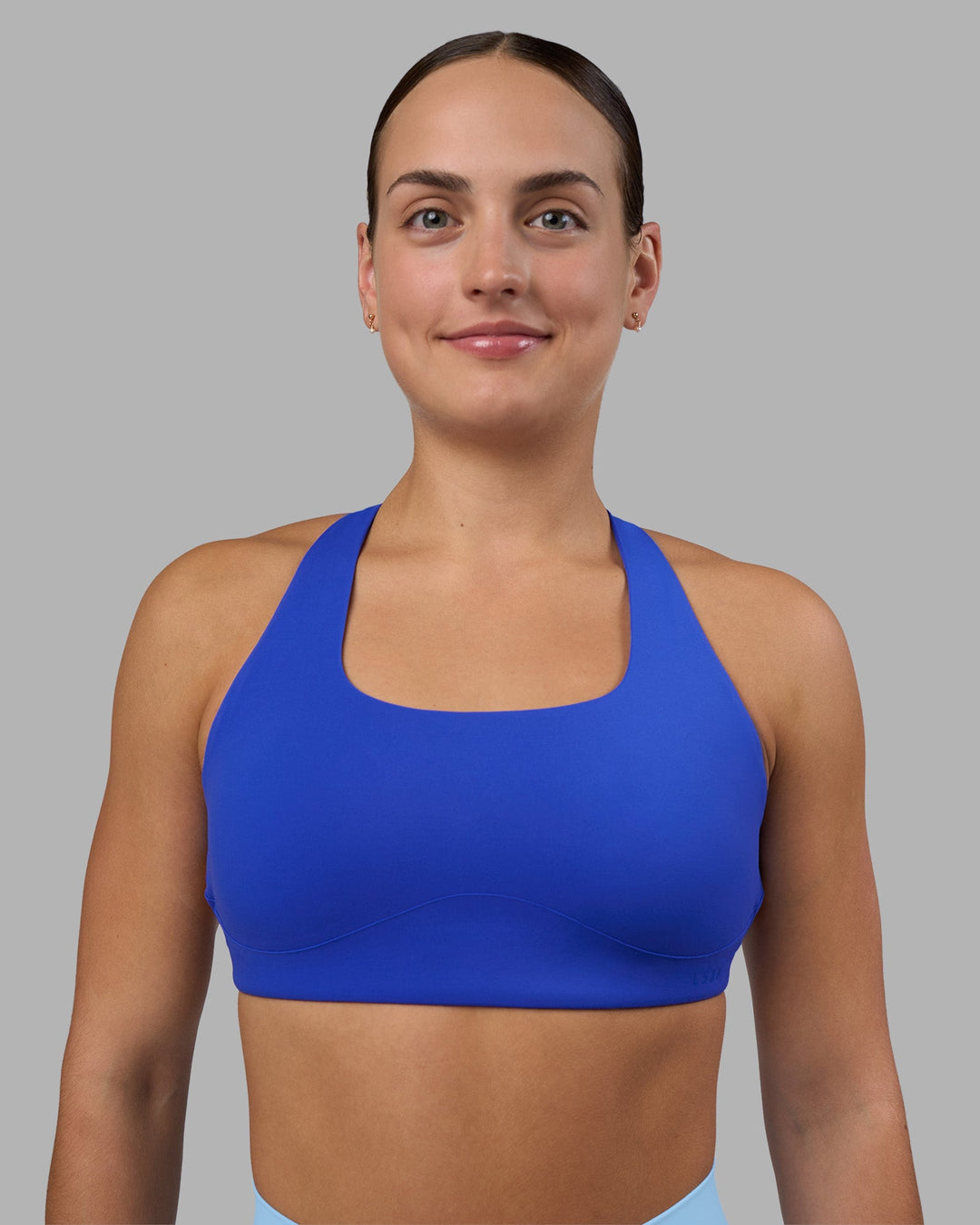 Woman wearing Aspire Sports Bra - Power Cobalt | Model:Keisha | Size:S