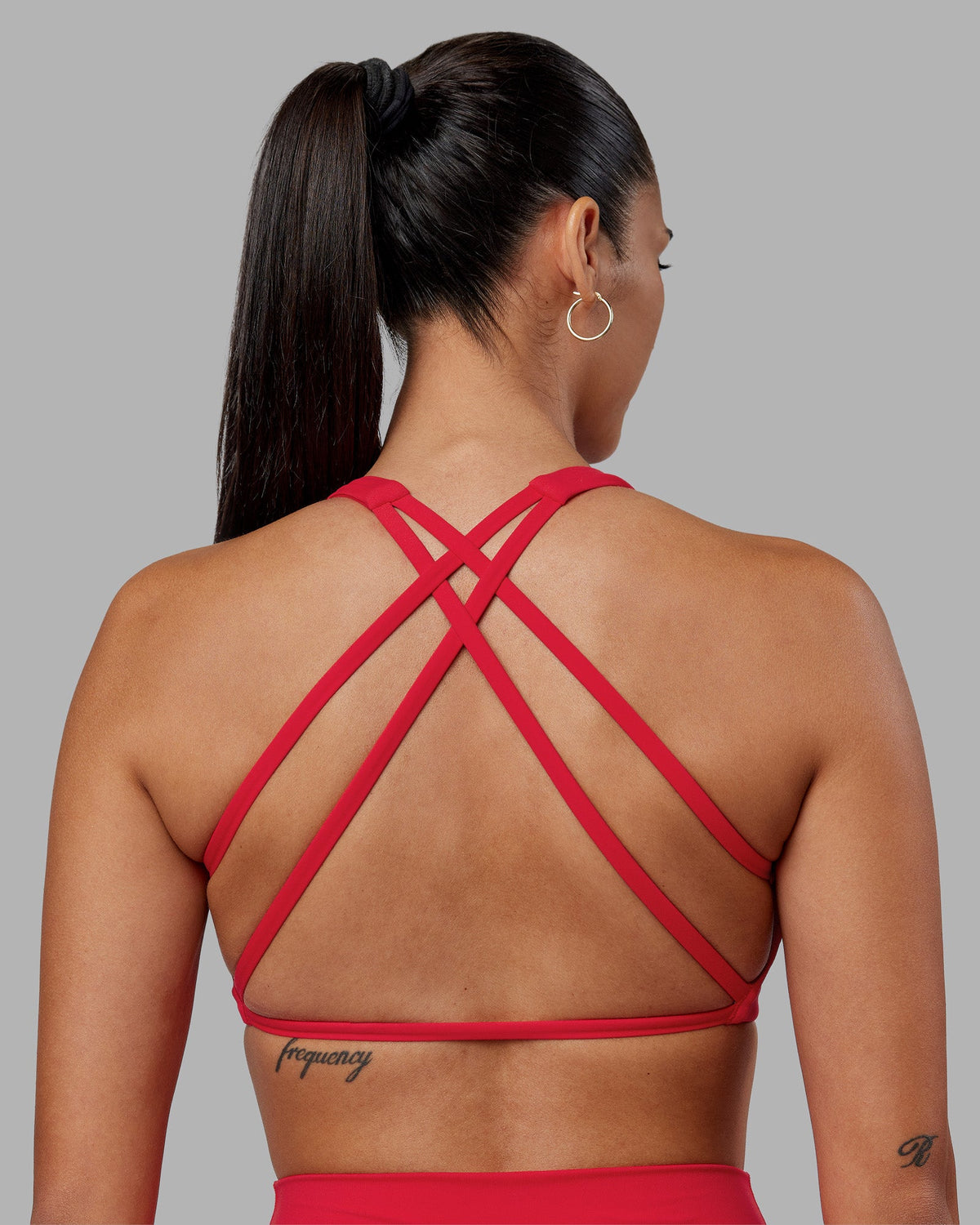 Woman wearing Aspire Sports Bra - Scarlet | Model:Rhiley | Size:S - view 1