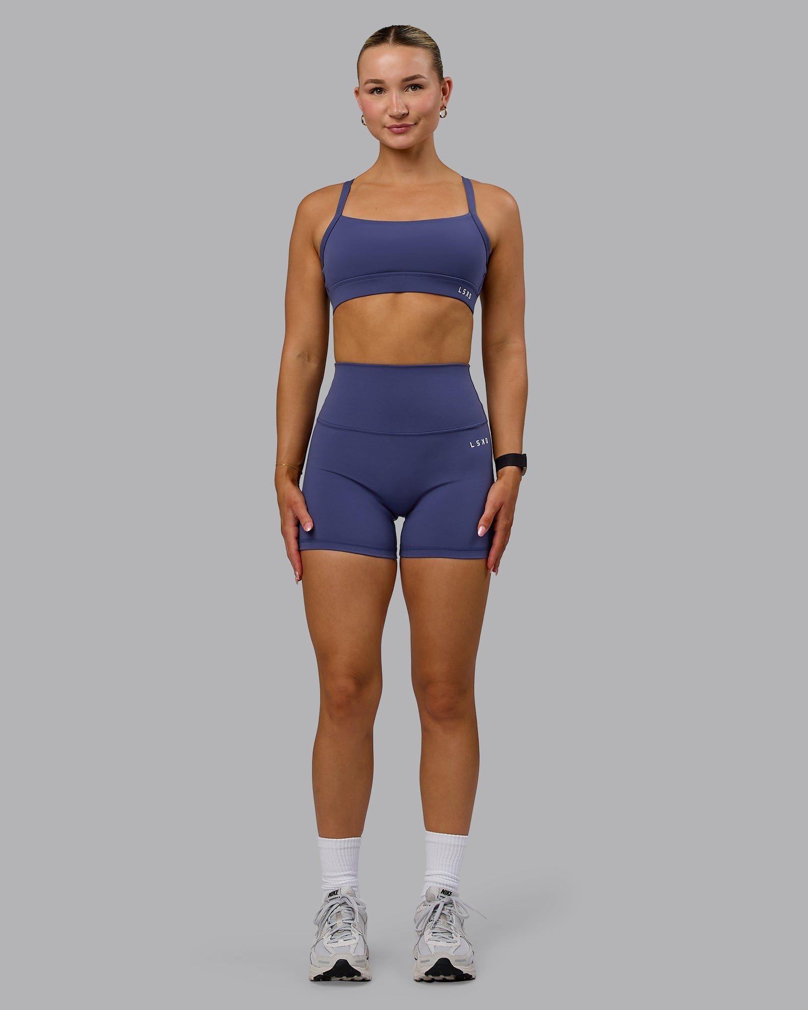 Woman wearing Base 2.0 Ultra High-Rise 4" Short Tights - Future Dusk