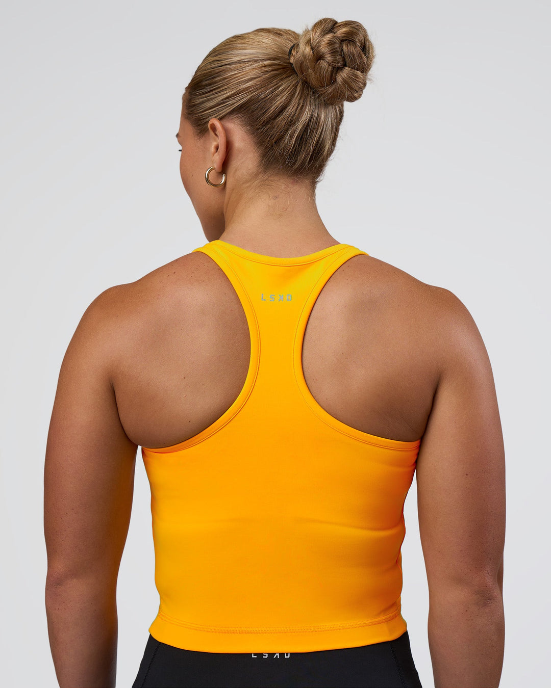 Woman wearing Be Bold Performance Tank - Zinnia | Model:Tenaya | Size:S