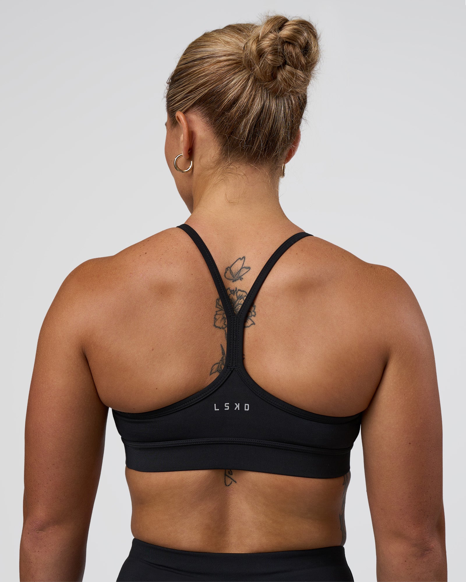 Woman wearing Be Bold Sports Bra - Black | Model:Tenaya | Size:S