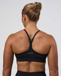 Woman wearing Be Bold Sports Bra - Black | Model:Tenaya | Size:S | Thumbnail Index: 1