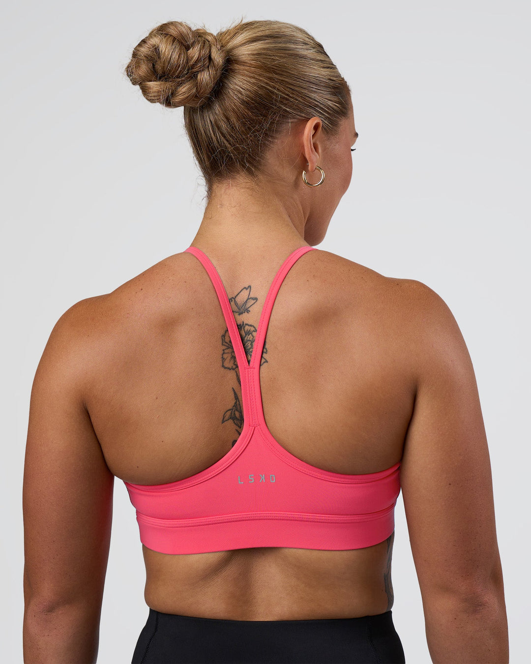 Woman wearing Be Bold Sports Bra - Bright Raspberry | Model:Tenaya | Size:S