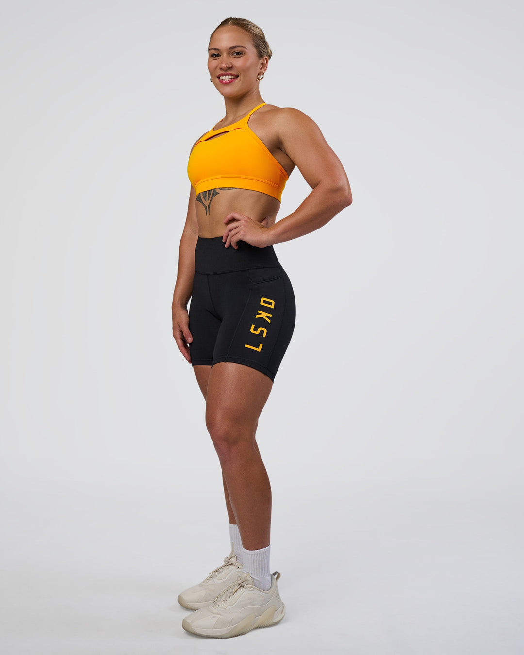 Woman wearing Be Bold Sports Bra - Zinnia | Model:Tenaya | Size:S