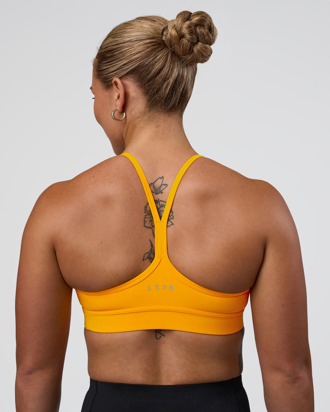 Woman wearing Be Bold Sports Bra - Zinnia | Model:Tenaya | Size:S