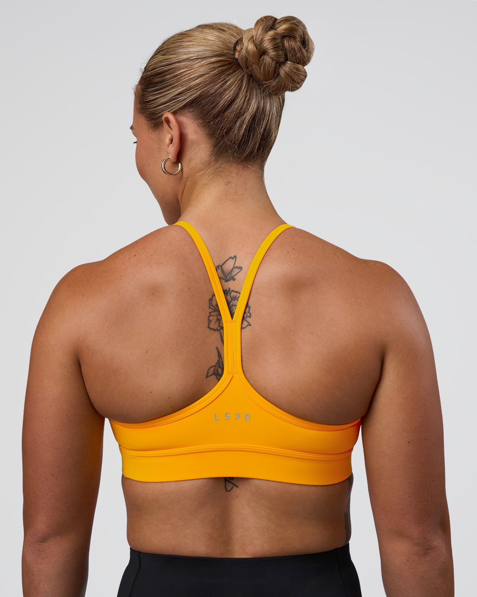 Woman wearing Be Bold Sports Bra - Zinnia | Model:Tenaya | Size:S